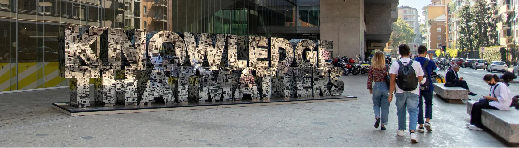 Bocconi entrance with the "Knowledge that Matters" motto in evidence